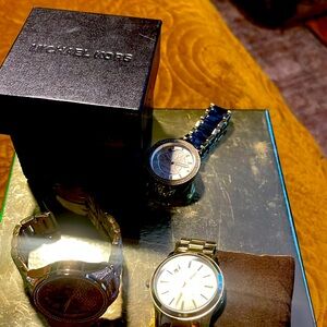 Three watches very pretty Michael Kors